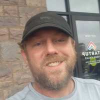 Jordan Mason, wearing a black cap, outside Startup Sioux Falls